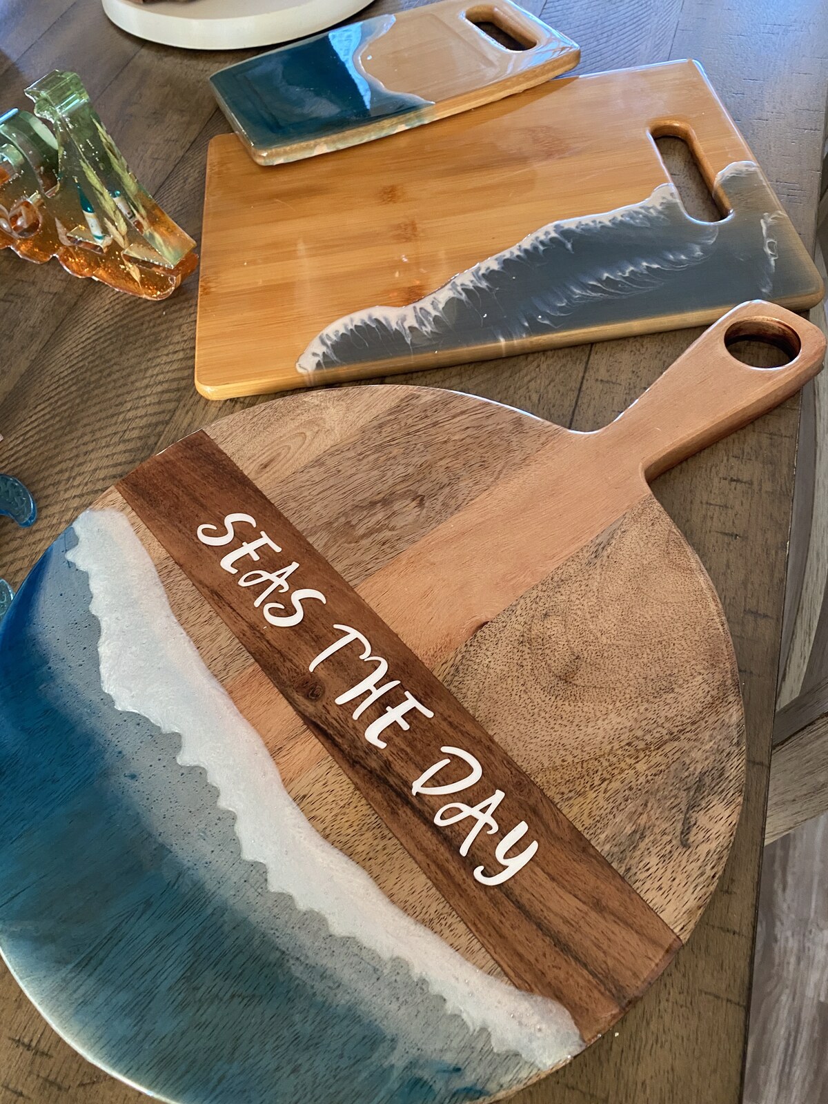 OBX resin word art, oyster shell pieces, and coastal collectibles on display